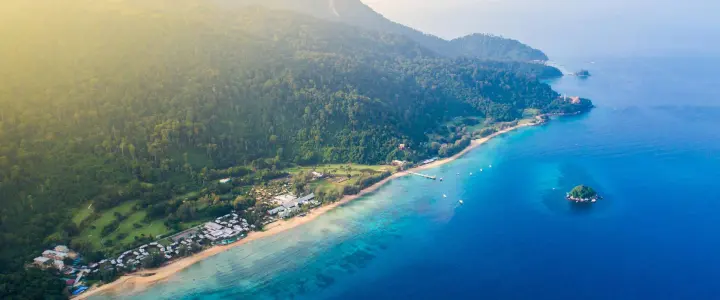 Tropical island beach and clear sea in Malaysia travel guide